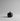 Black ceramic pumpkin-shaped container on a white background
