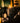 Candle labeled 'One More Chapter' with decorative elements on a dark background
